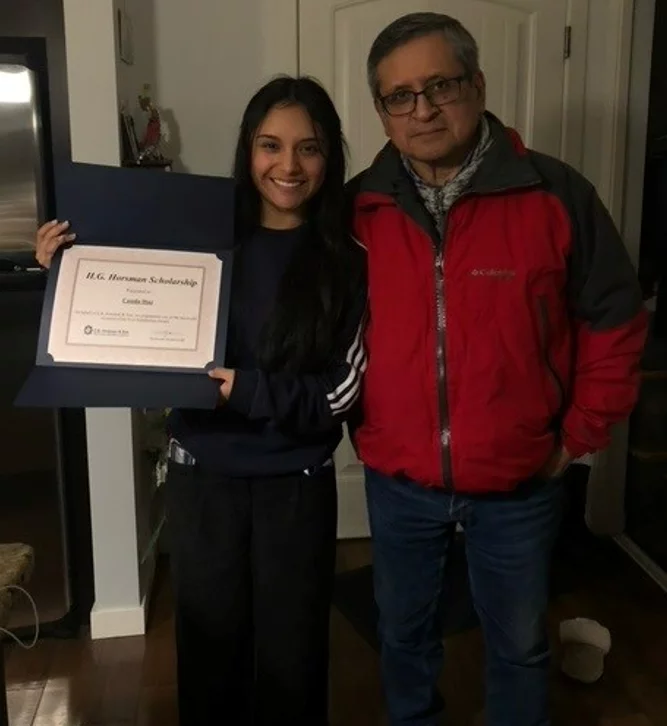 Camila showing her diploma