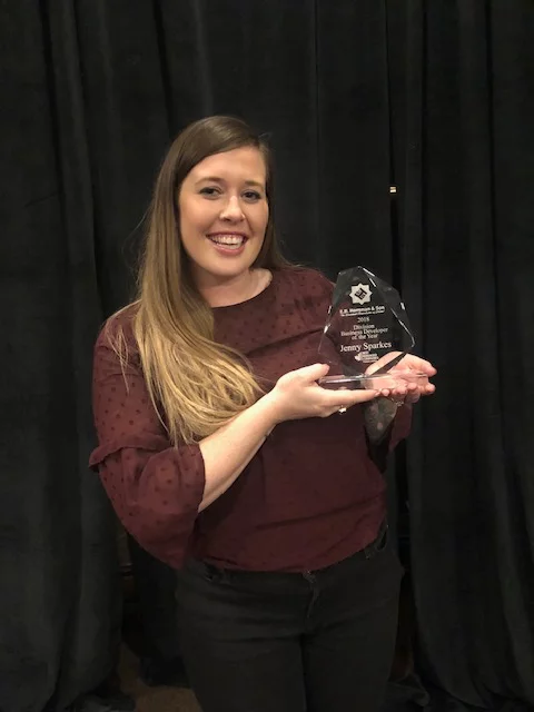 jenny holding an award