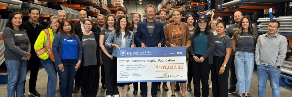 |||||||people standing in warehouse with cheque being presented