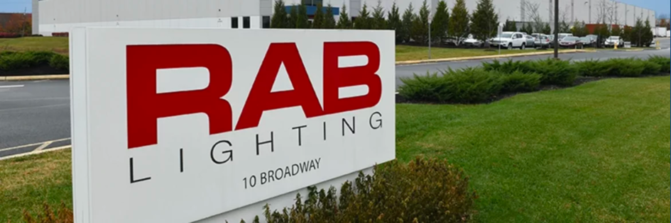 Dark blue letters spelling RAB with smaller dark blue letters spelling design under rab to the right